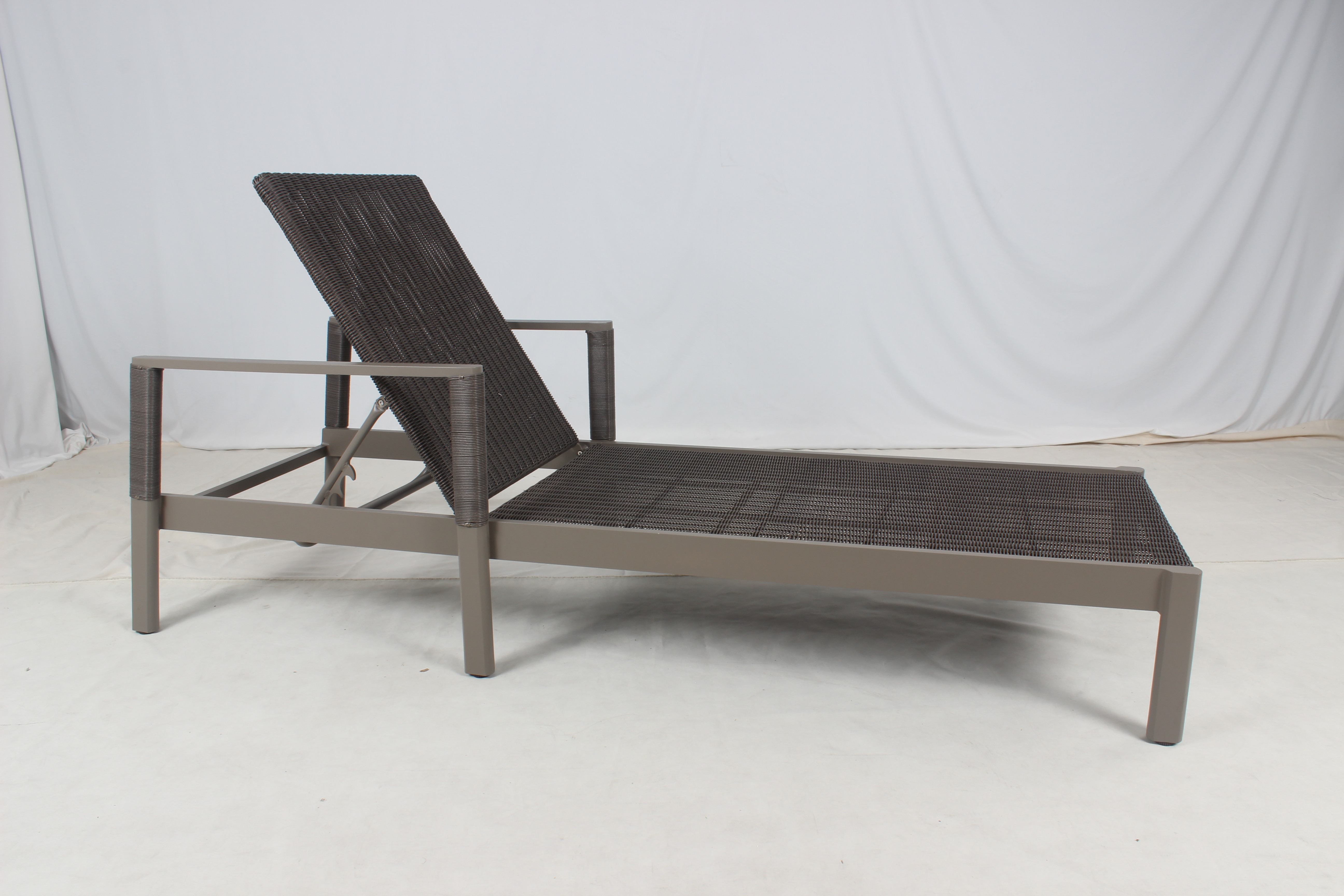 Outdoor wicker patio lounger with armrest